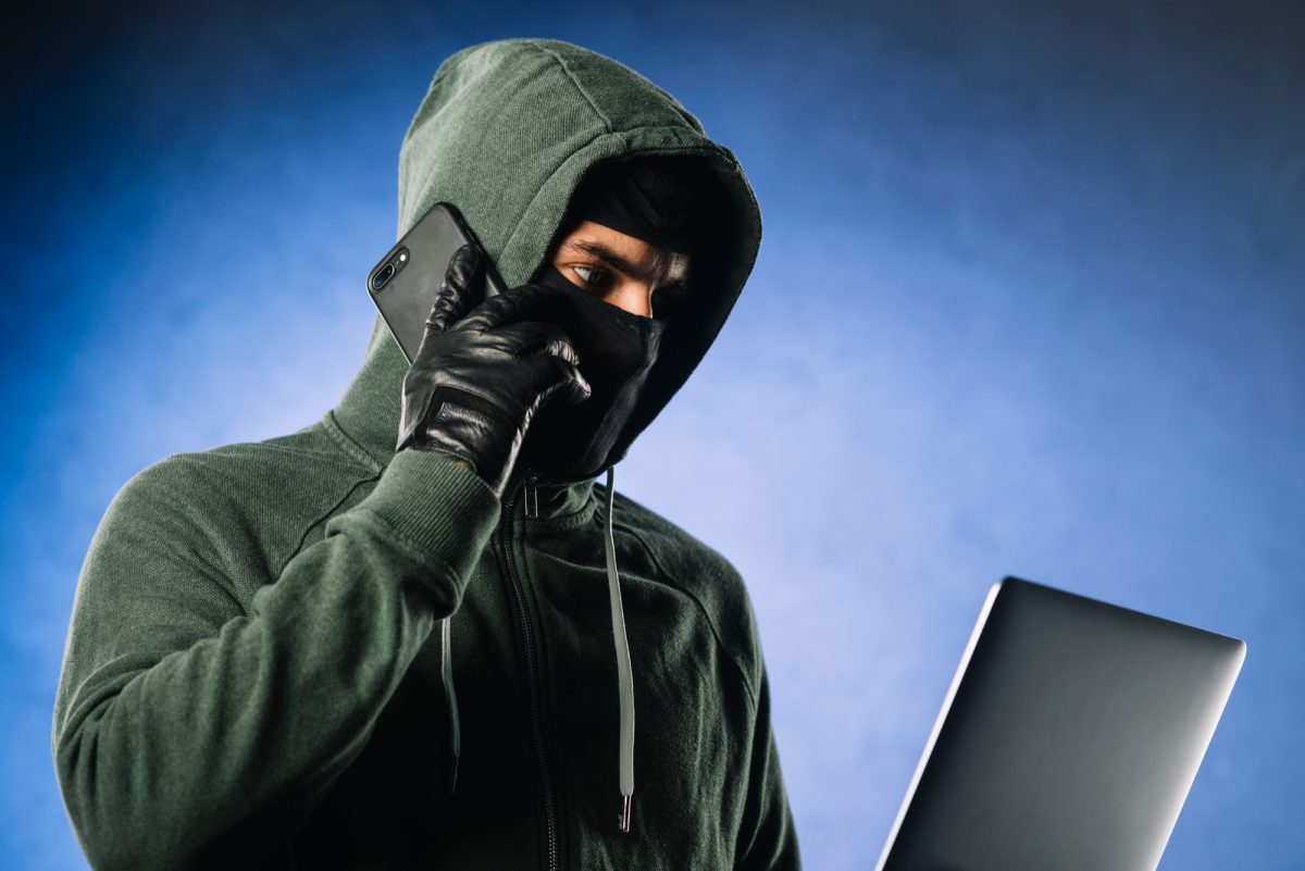 Scammer with laptop