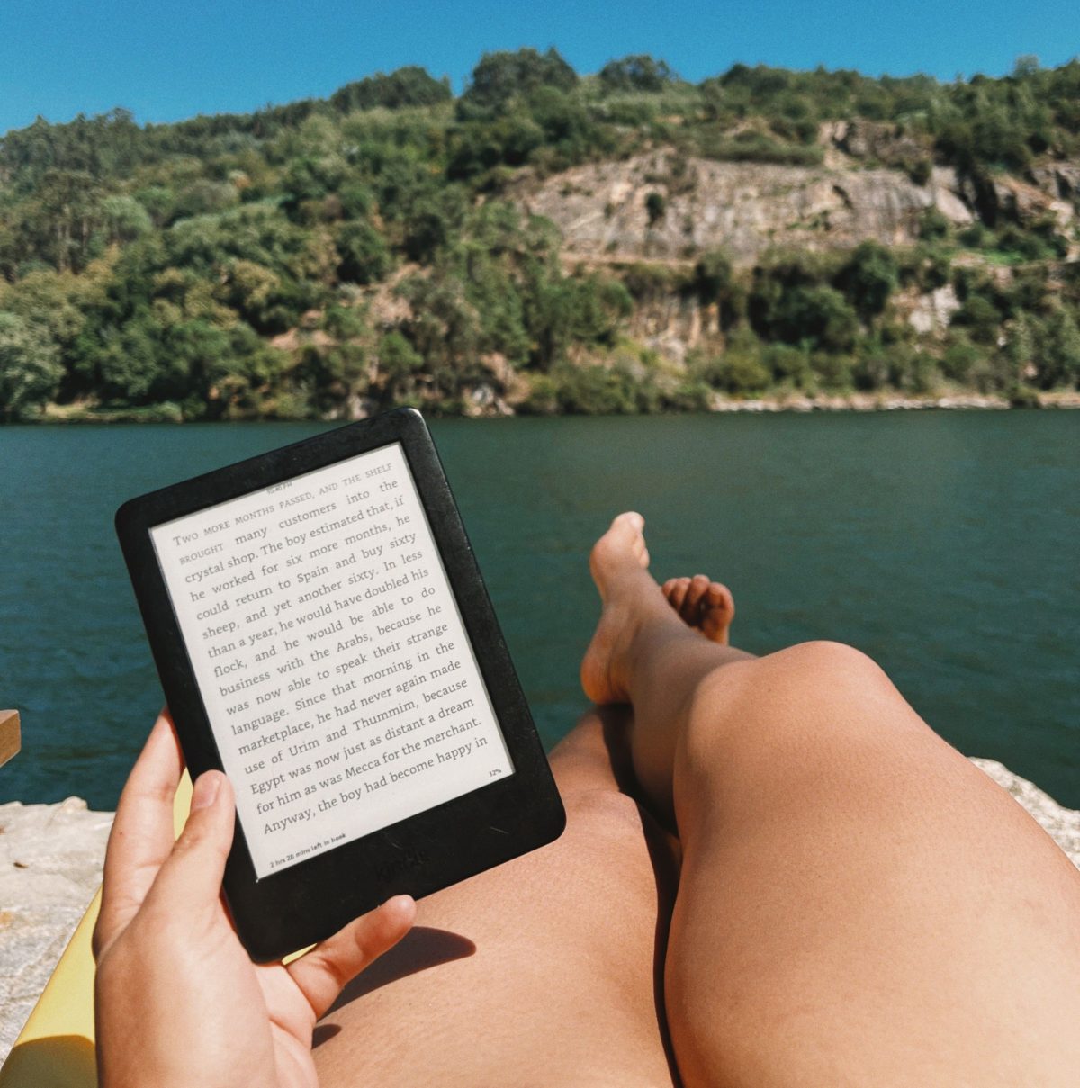 Woman relaxing with e-reader