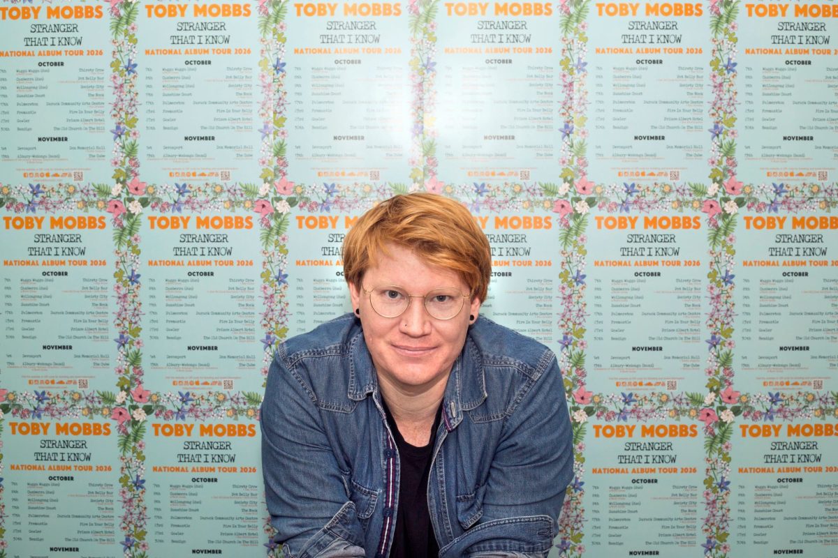 Toby Mobbs with tour posters